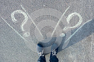 Female standing in front of two roads.