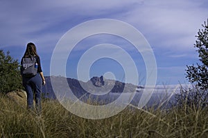 Female standing on a high hill