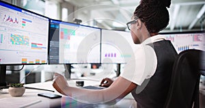 Female Stock Broker Analyzing Performance Graphs