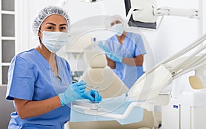 Female stomatologist preparing dental instruments for work