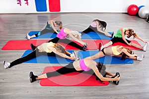 Female stretching in an aerobics exercise class