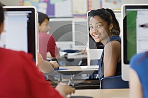 Female Student In Computer Laboratory With Classmates