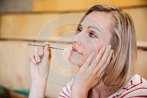 Female student day dreaming in a class