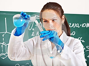 Female student with flask.