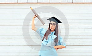 Female Student with Graduation Hat Holding a Big Pencil