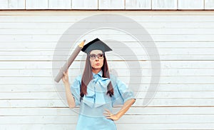 Female Student with Graduation Hat Holding a Big Pencil