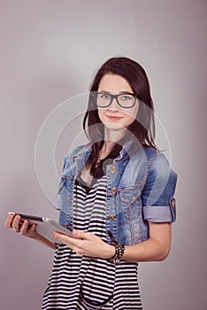 Female student with a laptop in the studio