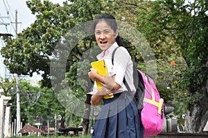Female Student And Laughter Wearing Backpack With Textbooks
