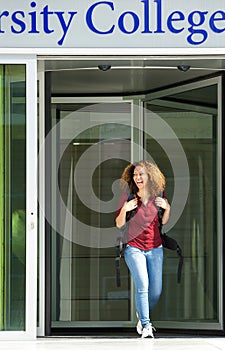 Female student leaving college building