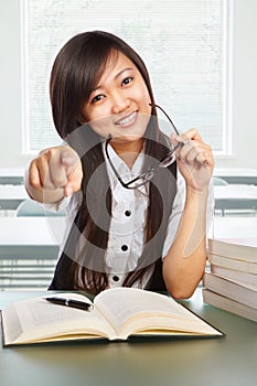 Female student pointing at camera