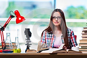 The female student preparing for chemistry exams