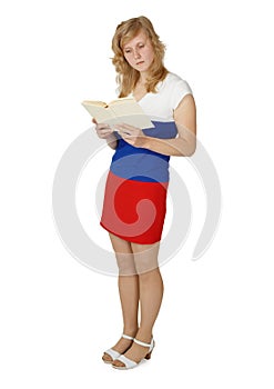 Female student reading a textbook