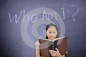 Female student standing with text of Who Am I