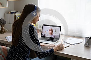 Female student study online with teacher on computer