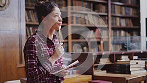 Female student studying at library