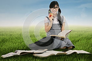 Female student studying outdoors