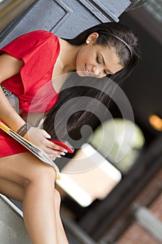 Female student using mobile phone to text