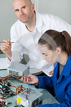 Female student in workshop electrical engineering