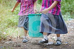 Female Students help to remove rubbish from the classroom