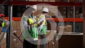 Female supervisor using tablet during stocktaking