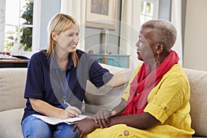 Female Support Worker Visits Senior Woman At Home