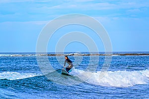 Female surfer on beautiful summer day