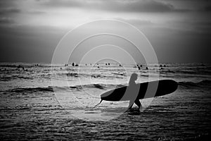 Female Surfer on the Beach