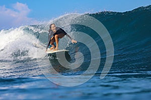 Female surfer on a wave