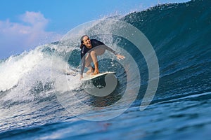 Female surfer on a wave