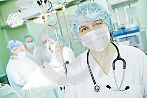 Female surgeon anaesthetist at child operating room photo