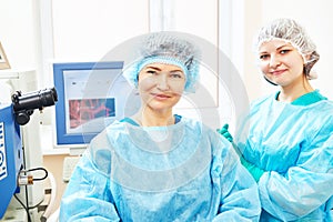 Female surgeon with assistant in operation room