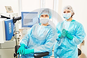 Female surgeon with assistant in operation room