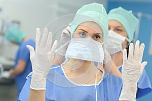 Female surgeon gettng ready for operation