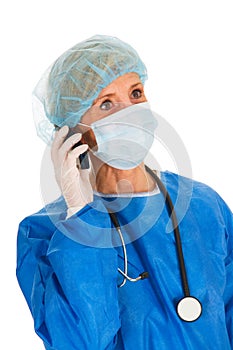 Female surgeon holding mobile