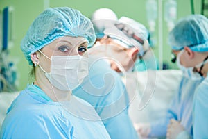 Female surgeon nurse at child operating room
