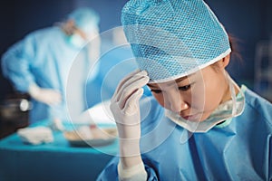 Female surgeon in operation room