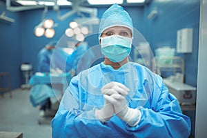 Female surgeon praying in operation theater