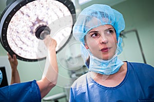 Female surgeon standing in operation room