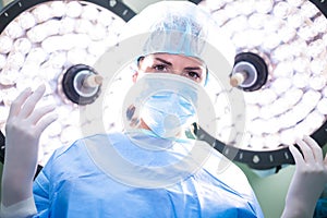 Female surgeon standing in operation room
