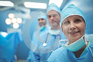 Female surgeon wearing surgical mask in operation theater