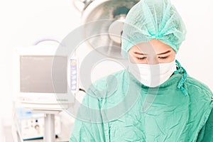 Female surgeon at work in operating room