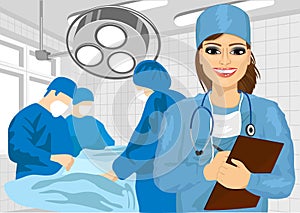 Female surgical nurse in operating room holding clipboard
