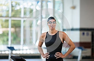 Female swimmer smiling and focusing before the race start