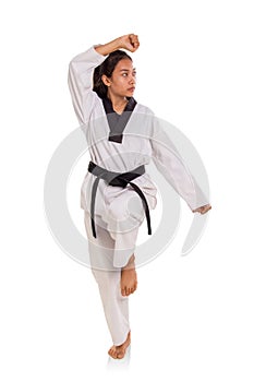 Female tae-kwon-do athlete making a pose full length