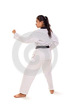Female taekwondo fighter standing full body rear view