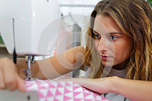 female tailor using sewing machine