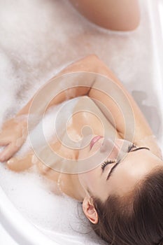 Female taking a bath.