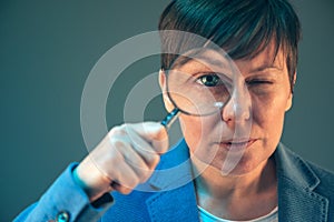 Female tax inspector with magnifying glass