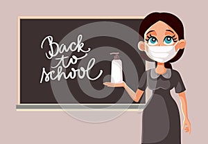 Female Teacher with Face Mask and Hand Sanitizer at School Reopening