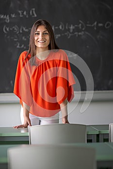 Female teacher in front of a classroom